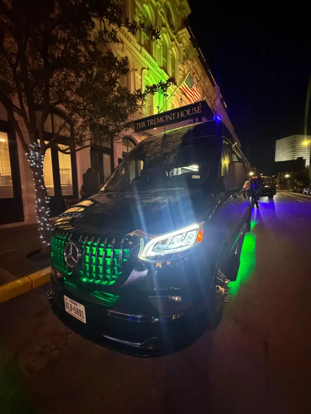 Nick Sadiku’s black Executive Sprinter shown from the exterior front quarter at night