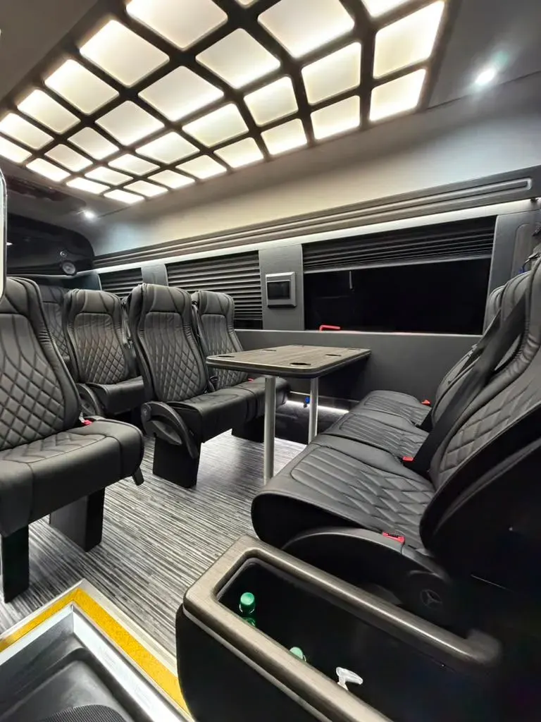 Executive Sprinter premium rear passenger cabin with a table and passenger seating