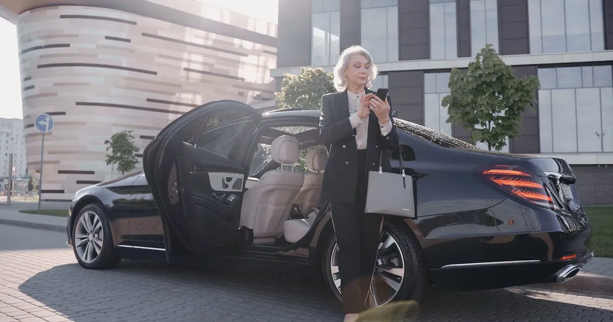 Luxury vehicle moving through Houston after dark
