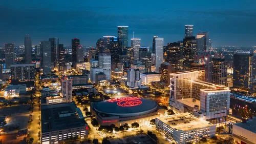Houston skyline glowing at blue hour above downtown